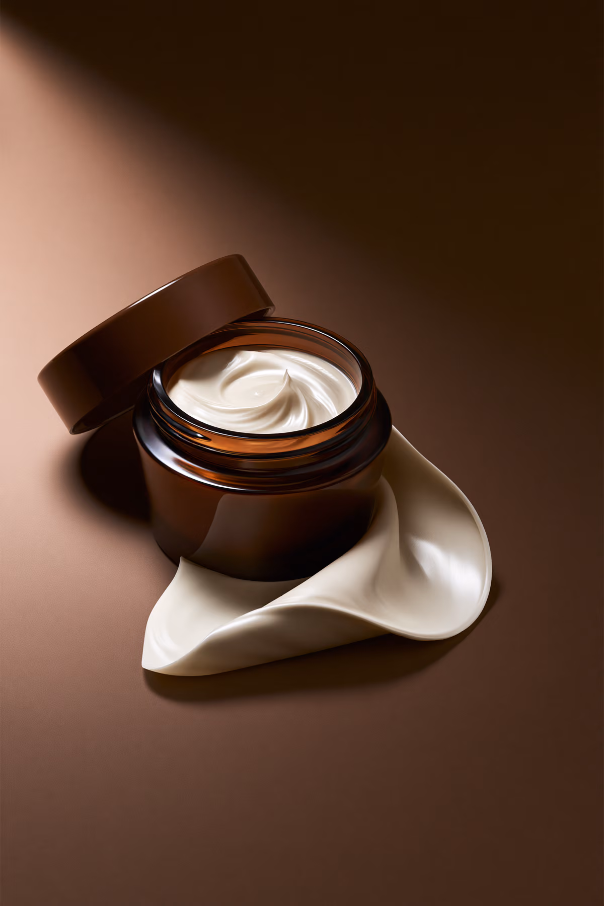 Minimal skincare jar with cream texture on warm background
