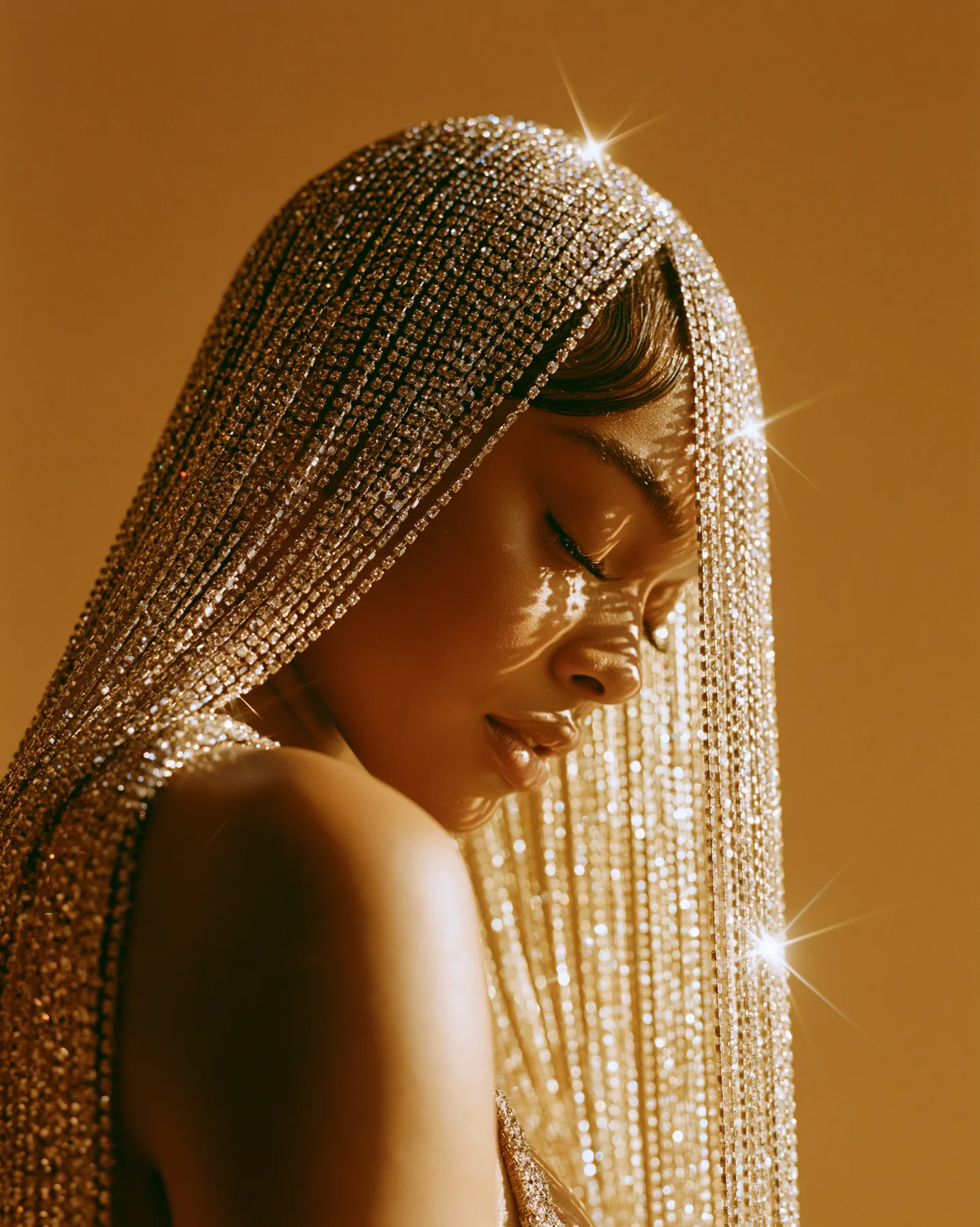 Fashion jewelry editorial portrait with adult model in profile and crystal veil