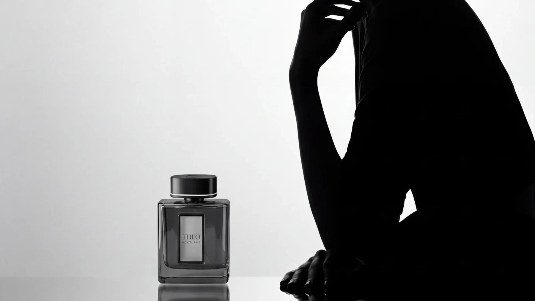THEO Nocturne perfume bottle on silk with shadow patterns in black and white